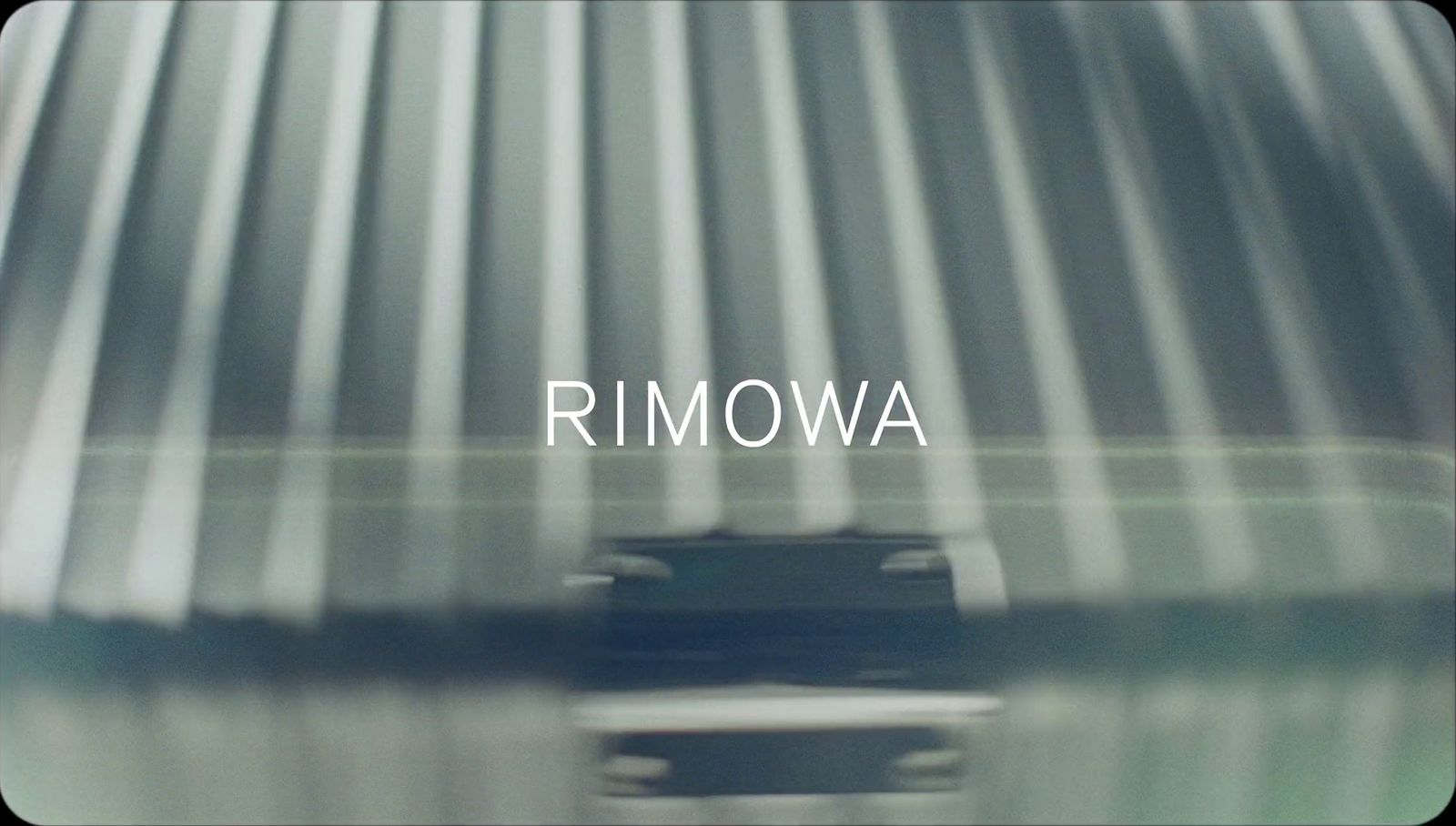 a close up of a metal roof with the word rimowaa on it