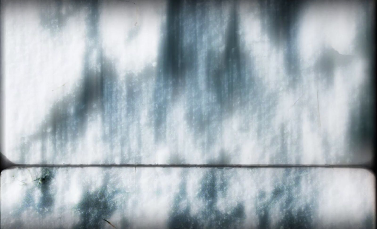 a black and white photo of snow on a window sill