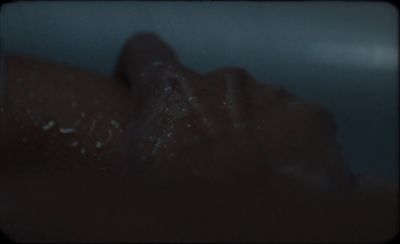 a close up of a person laying down in a bathtub