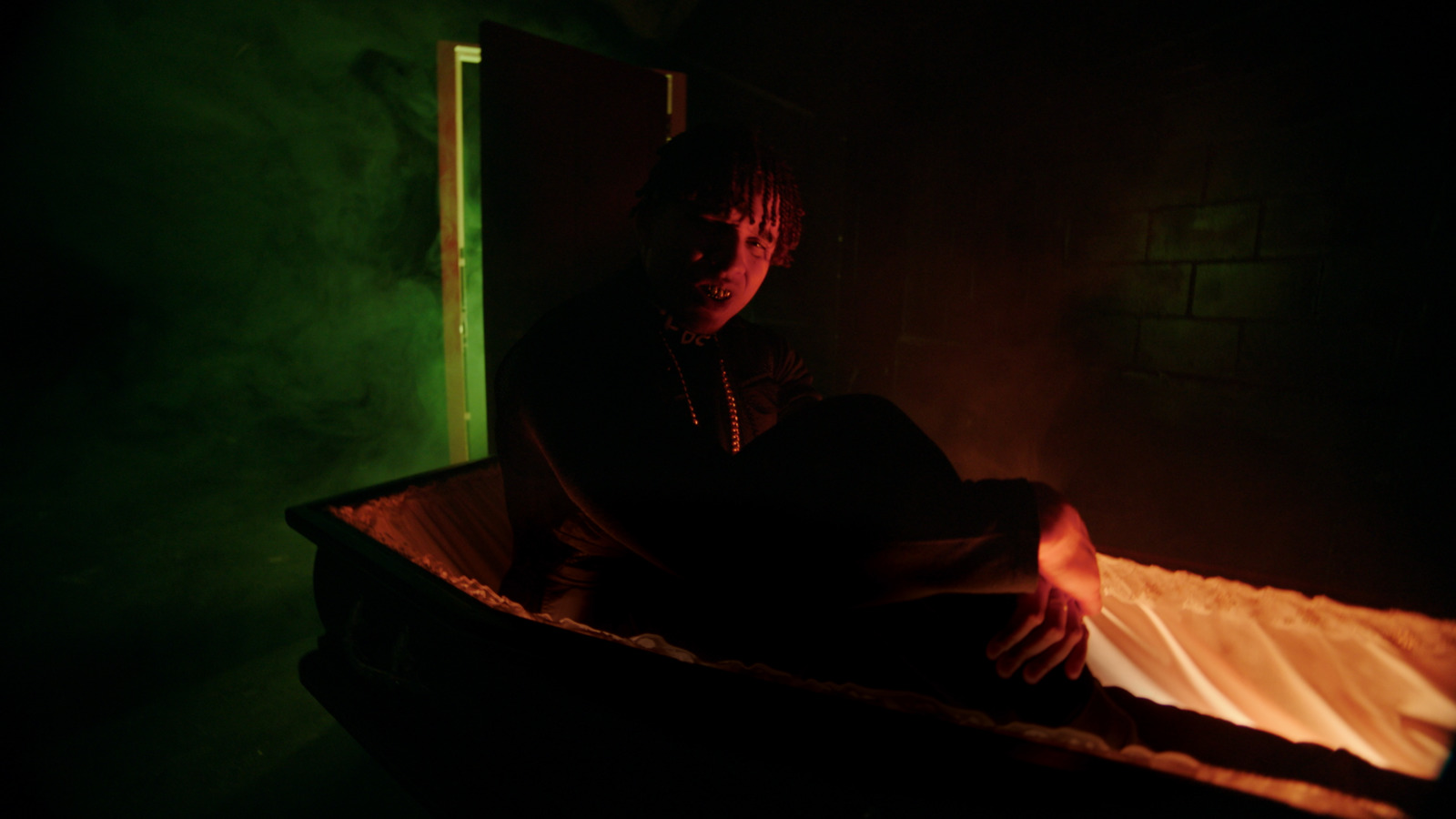 a woman sitting in a bathtub in a dark room