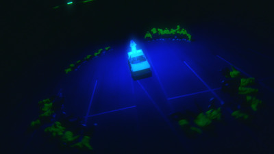 a tennis court lit up in the dark