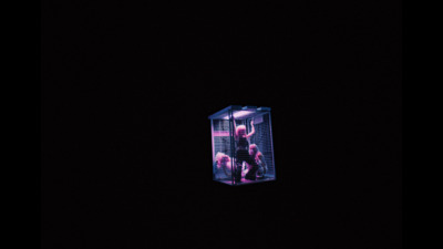 a person in a cage in the dark