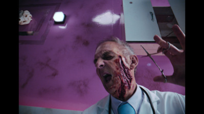 a man with blood on his face and a stethoscope