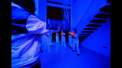 a group of people walking down a hallway