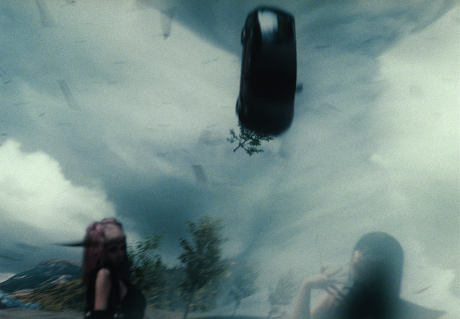 a woman sitting on a bench in front of a painting