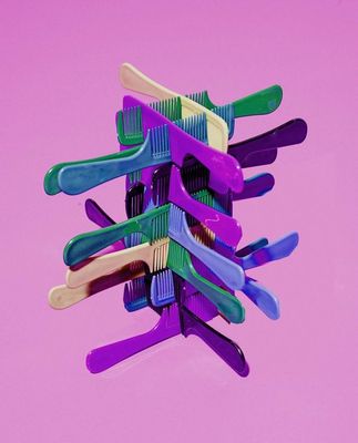 a bunch of toothbrushes stacked on top of each other