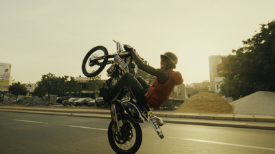 a person doing a trick on a motorcycle