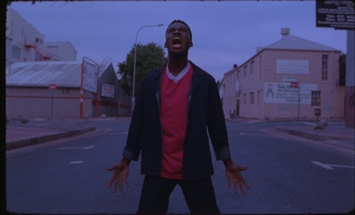 a man standing in the middle of a street