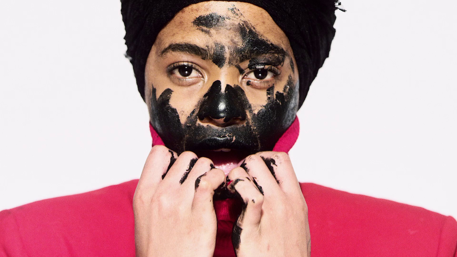 a man with black face paint on his face