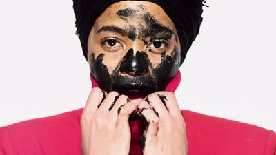 a man with black face paint on his face