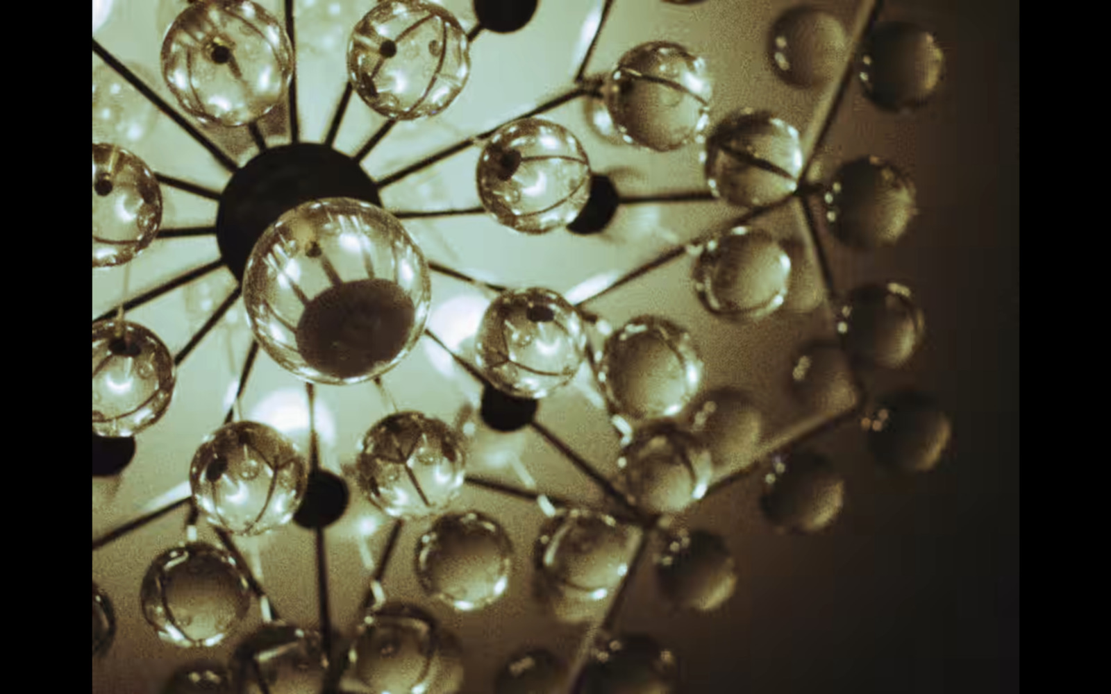 a chandelier hanging from a ceiling in a room