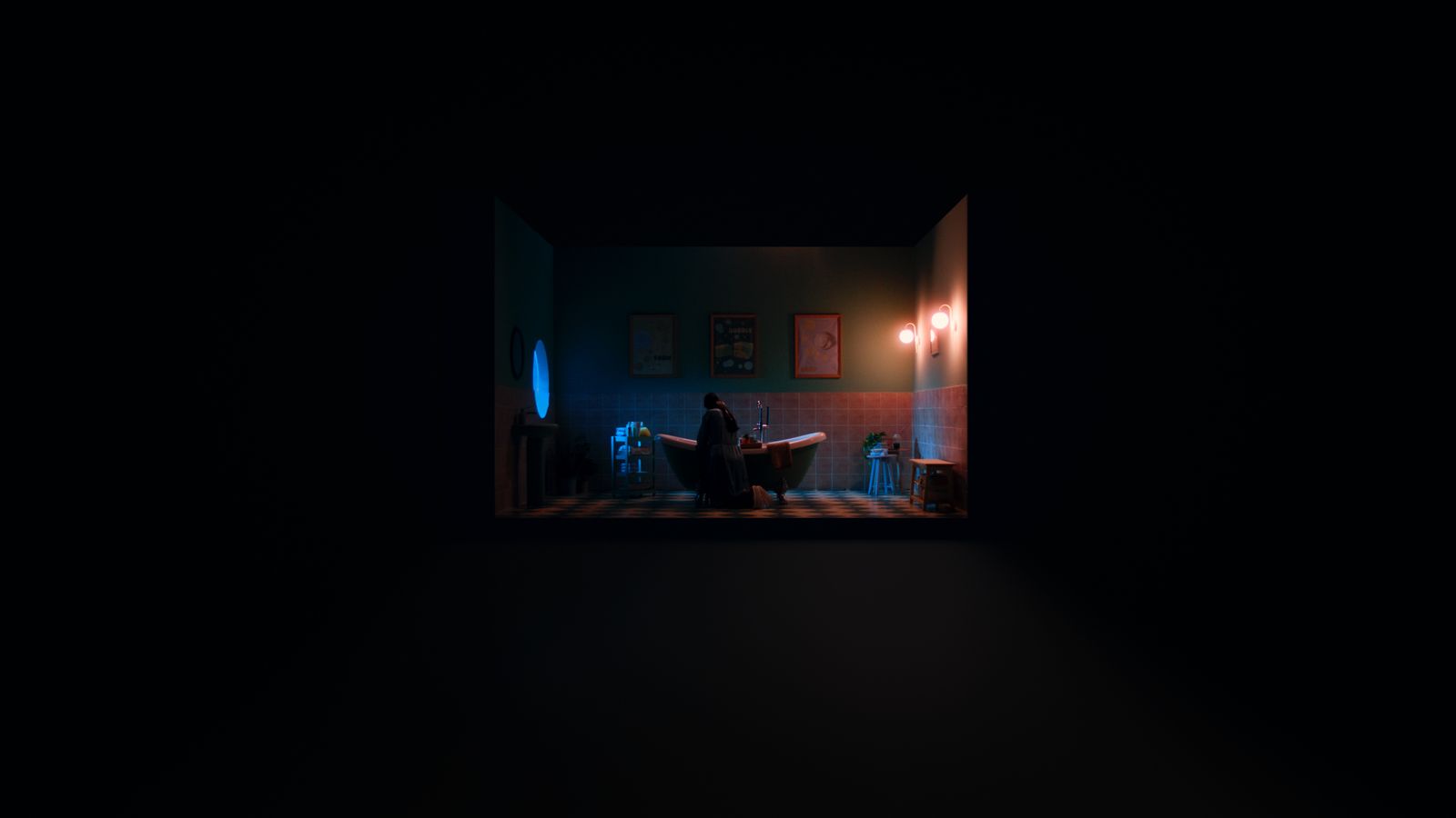 a dark room with a person sitting in a chair