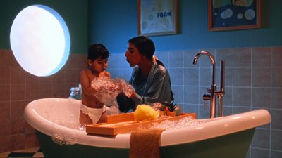 a man and a little girl in a bathtub