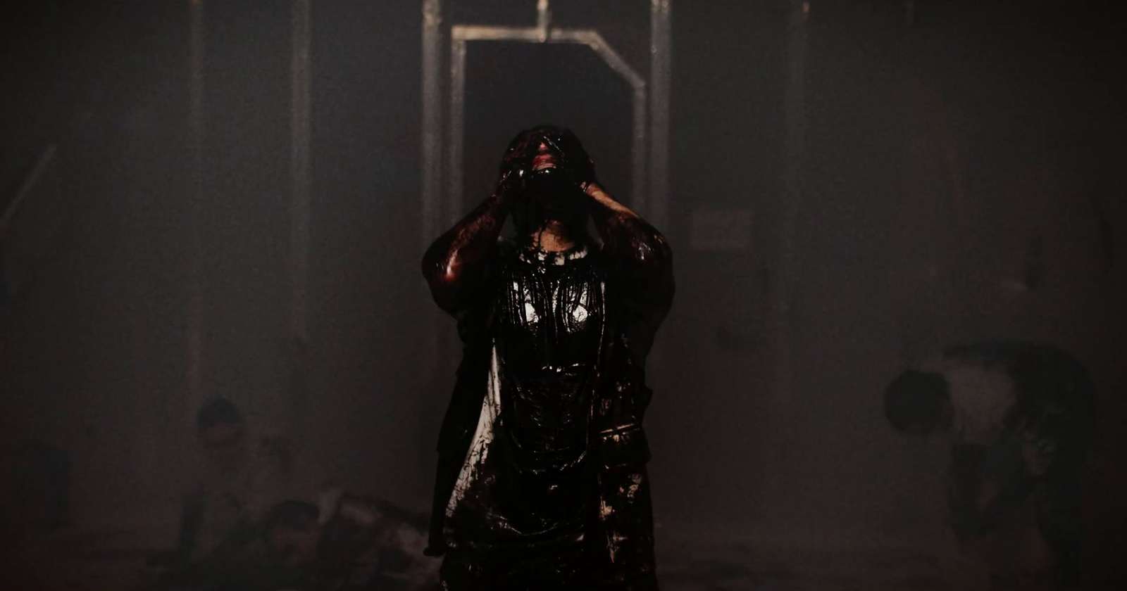 a woman standing in a dark tunnel with her hands on her head