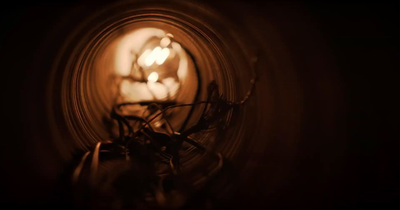 a close up of a light bulb in a dark room