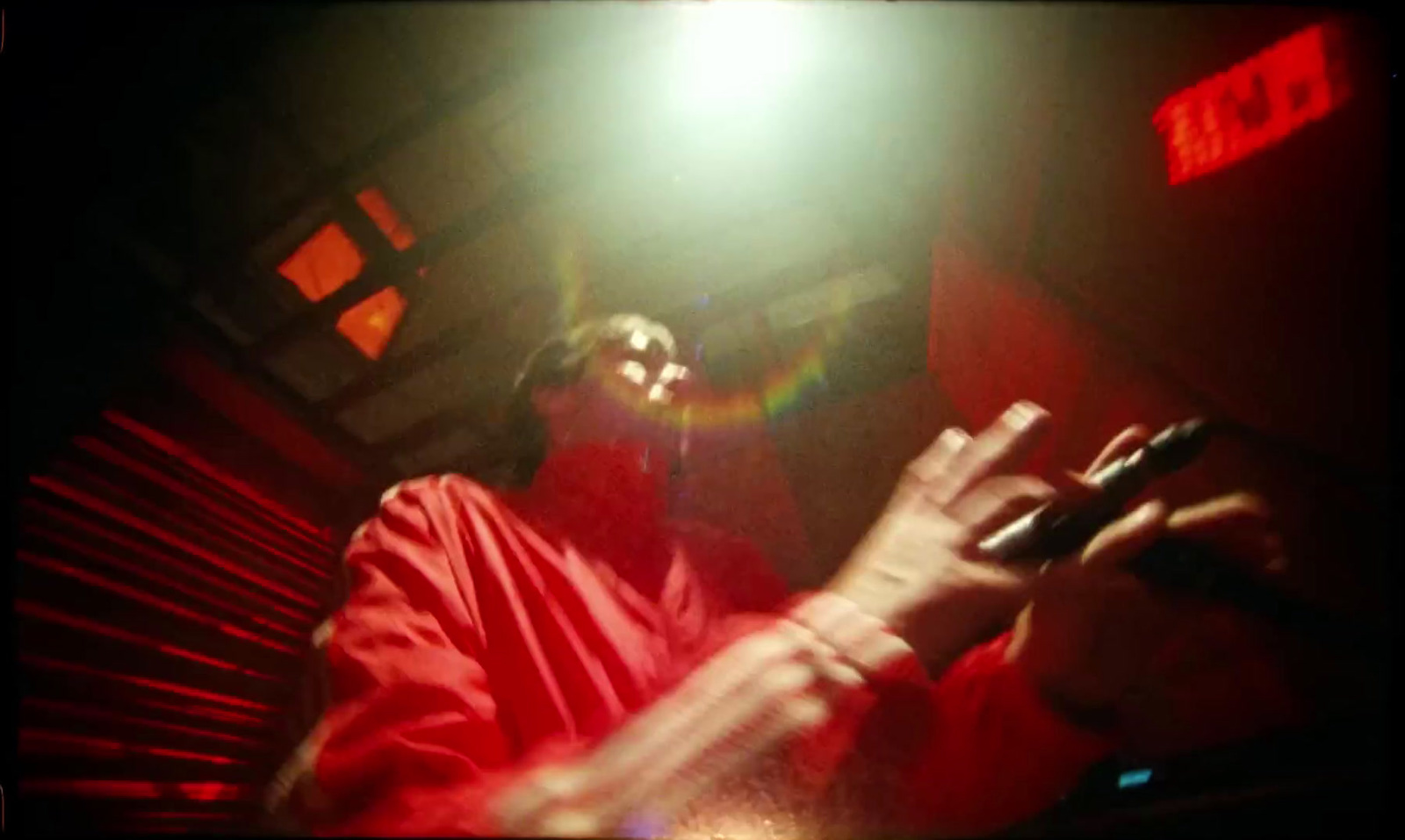 a person in a red outfit holding a cell phone