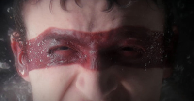 a close up of a person with a bloody face