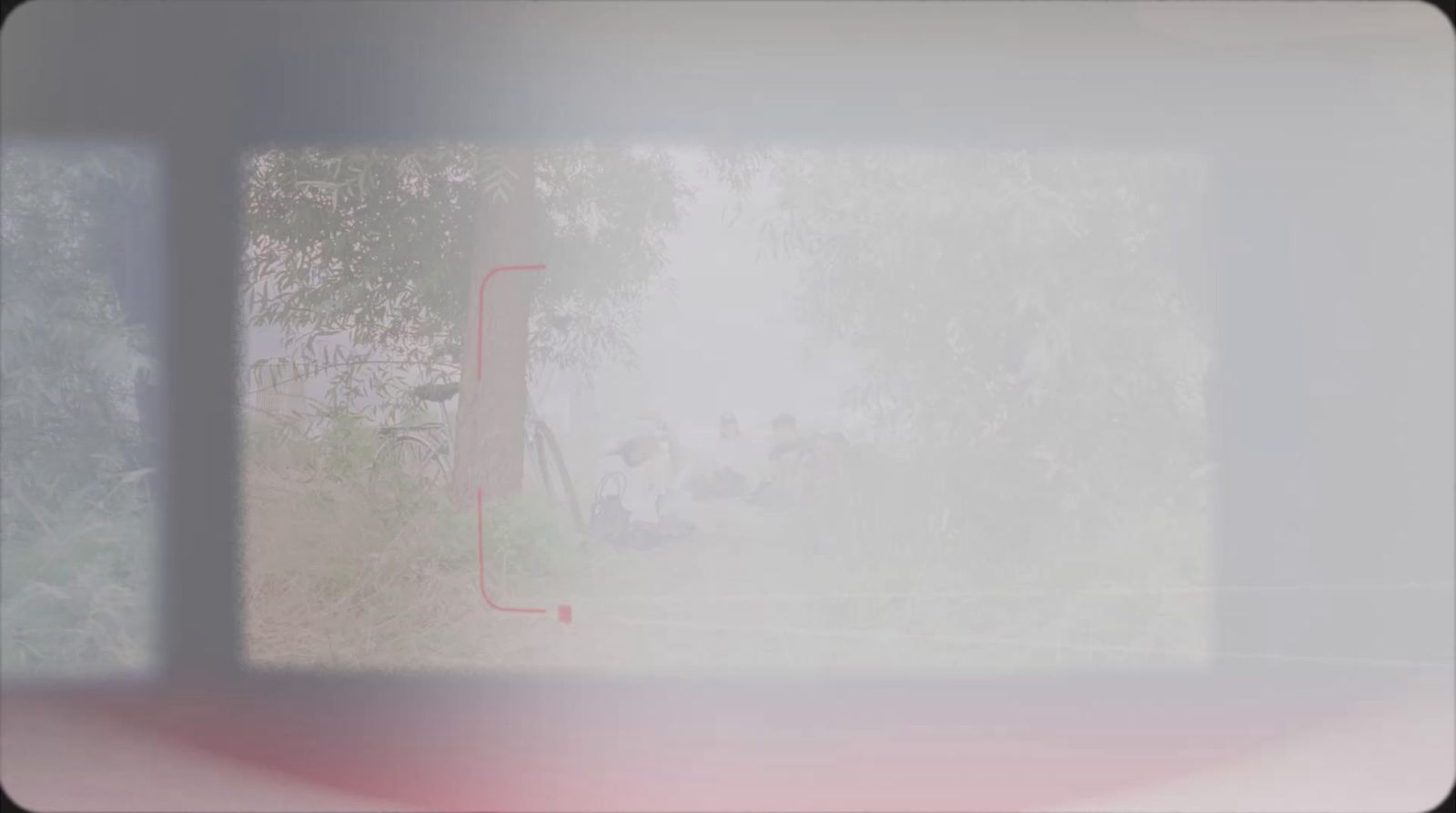 a blurry photo of a window with trees in the background