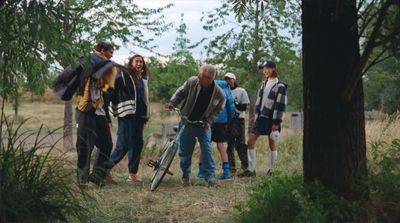 a group of people standing around each other