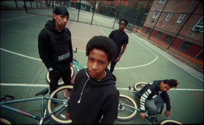 a group of young men standing on top of a tennis court