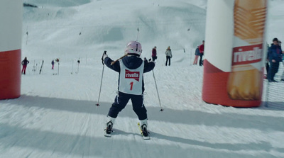 a person riding skis on a snowy surface