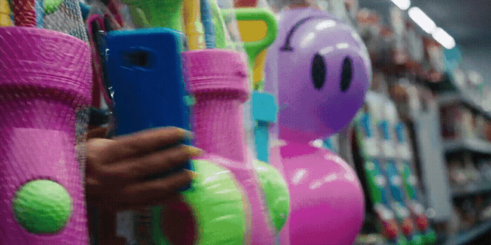 a person holding a cell phone in a store