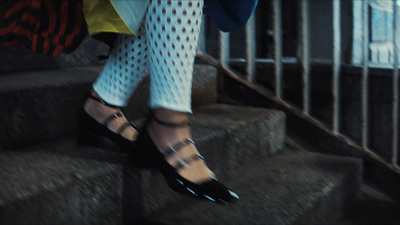 a woman walking up a flight of stairs