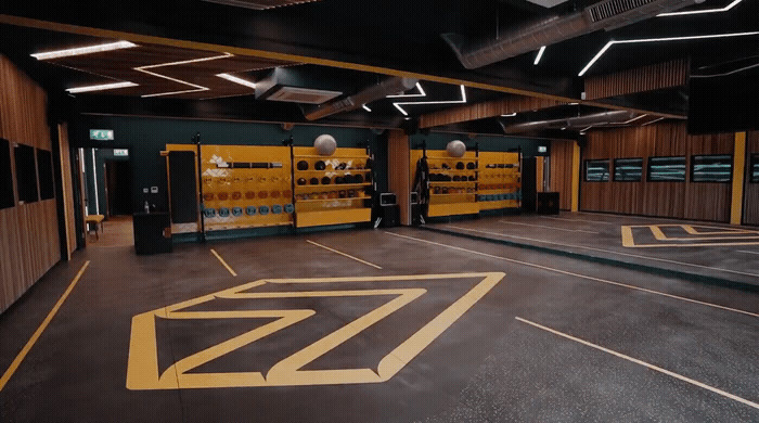 an empty parking garage with yellow and black markings