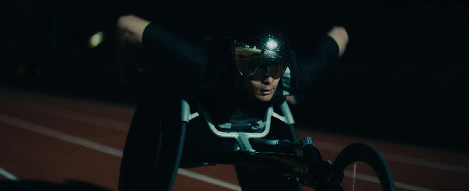 a man in a wheel chair on a track