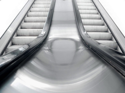 an escalator with two escalators going down it