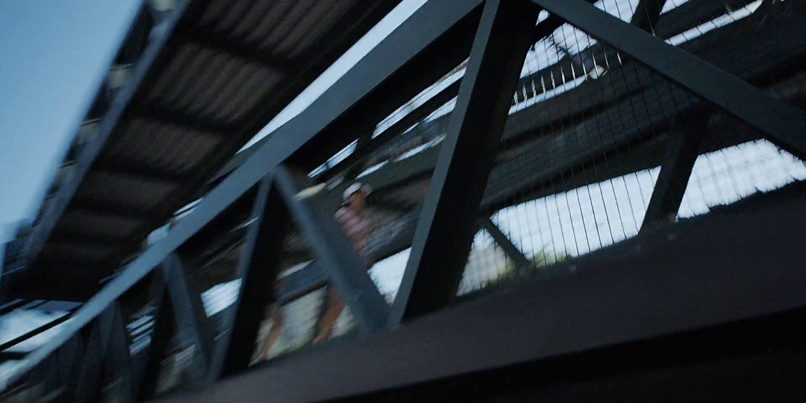 a man riding a skateboard down a metal ramp