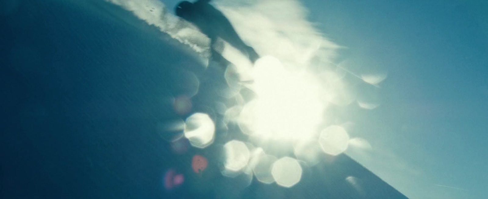 a person is snowboarding down a snowy hill