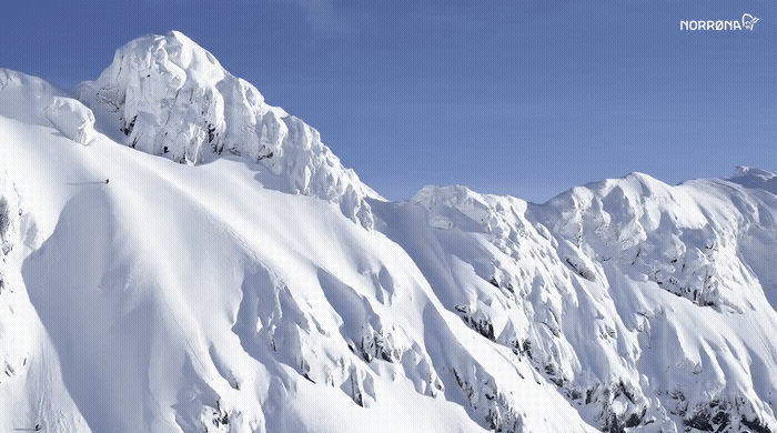 a person skiing down a snowy mountain side