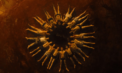 a group of people standing in the middle of a circle