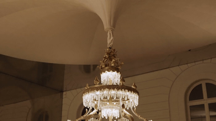 a chandelier hanging from a ceiling in a room