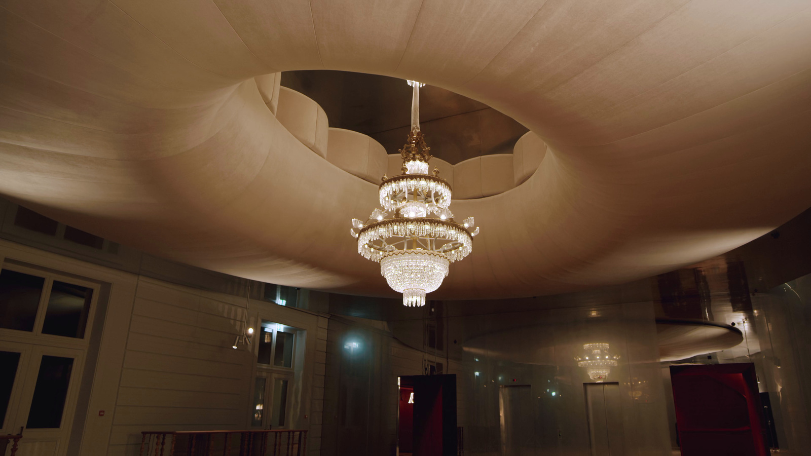 a chandelier hanging from the ceiling of a room