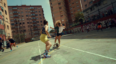 a couple of women playing a game of basketball