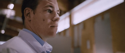 a man in a white shirt and blue tie