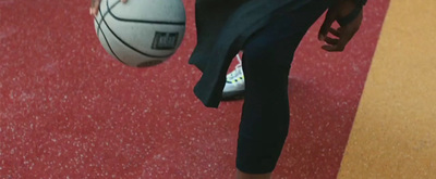 a close up of a person holding a basketball