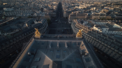 an aerial view of a city with tall buildings