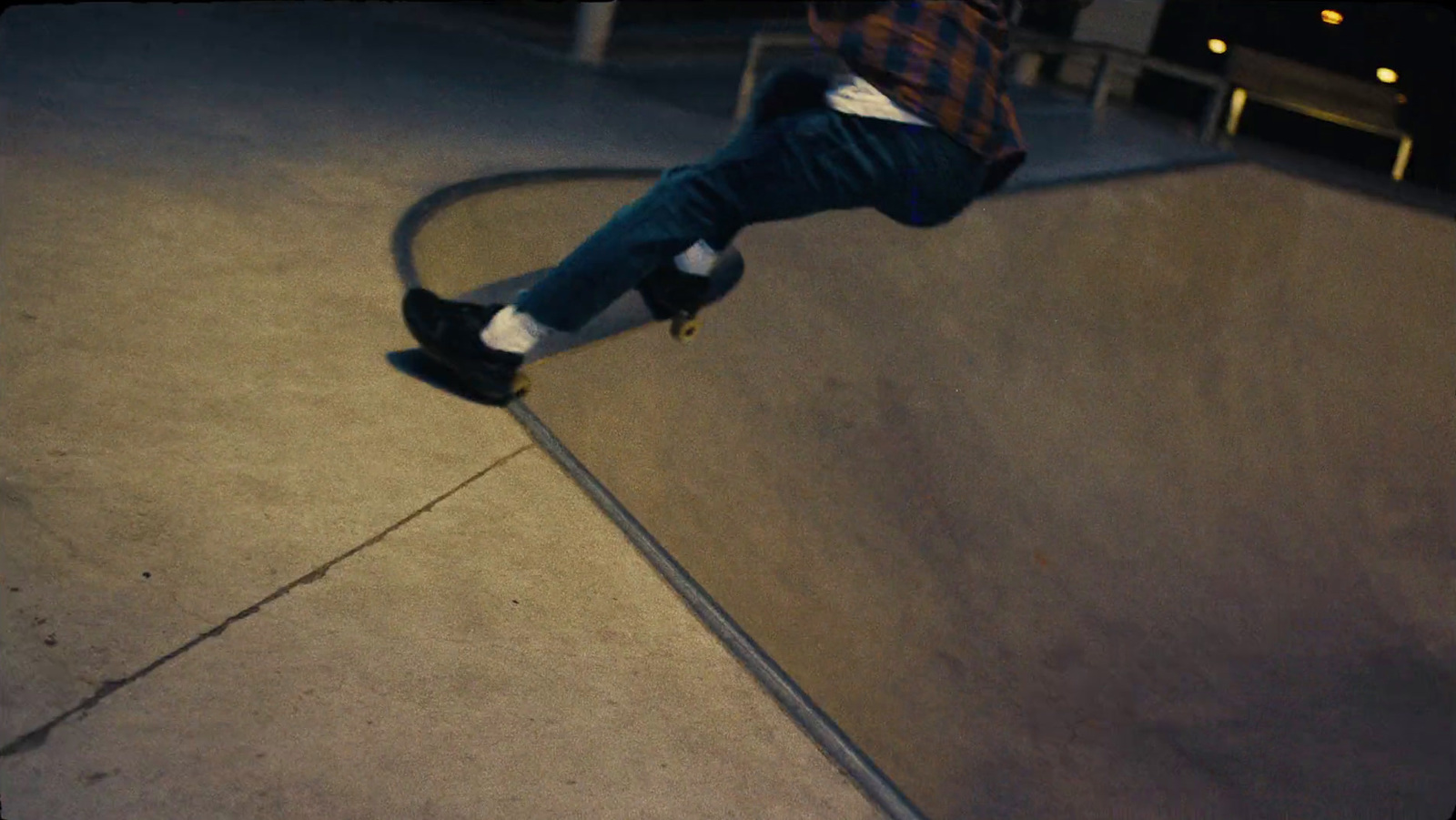 a man riding a skateboard up the side of a ramp