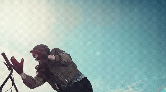 a person on a snowboard doing a trick in the air