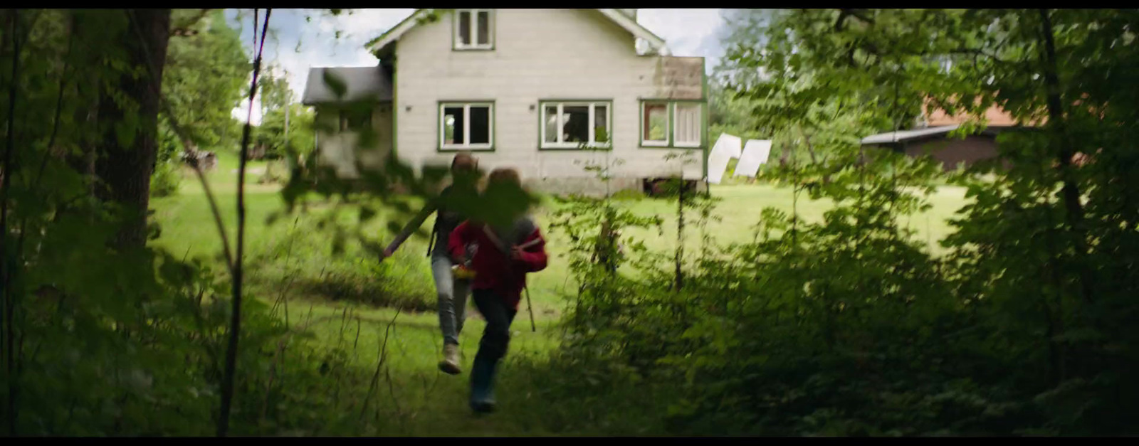 a person with a backpack is walking through the woods