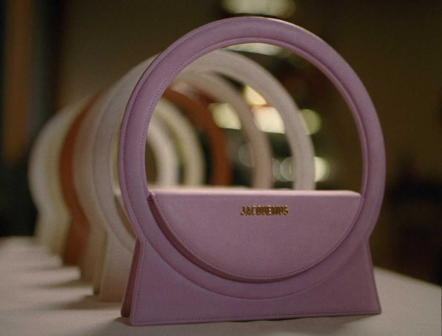 a purple purse sitting on top of a table