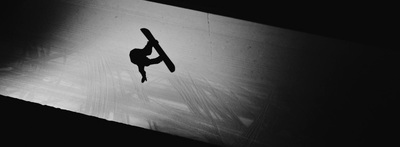 a person doing a handstand on a skateboard