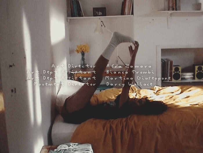 a woman laying on a bed reading a book