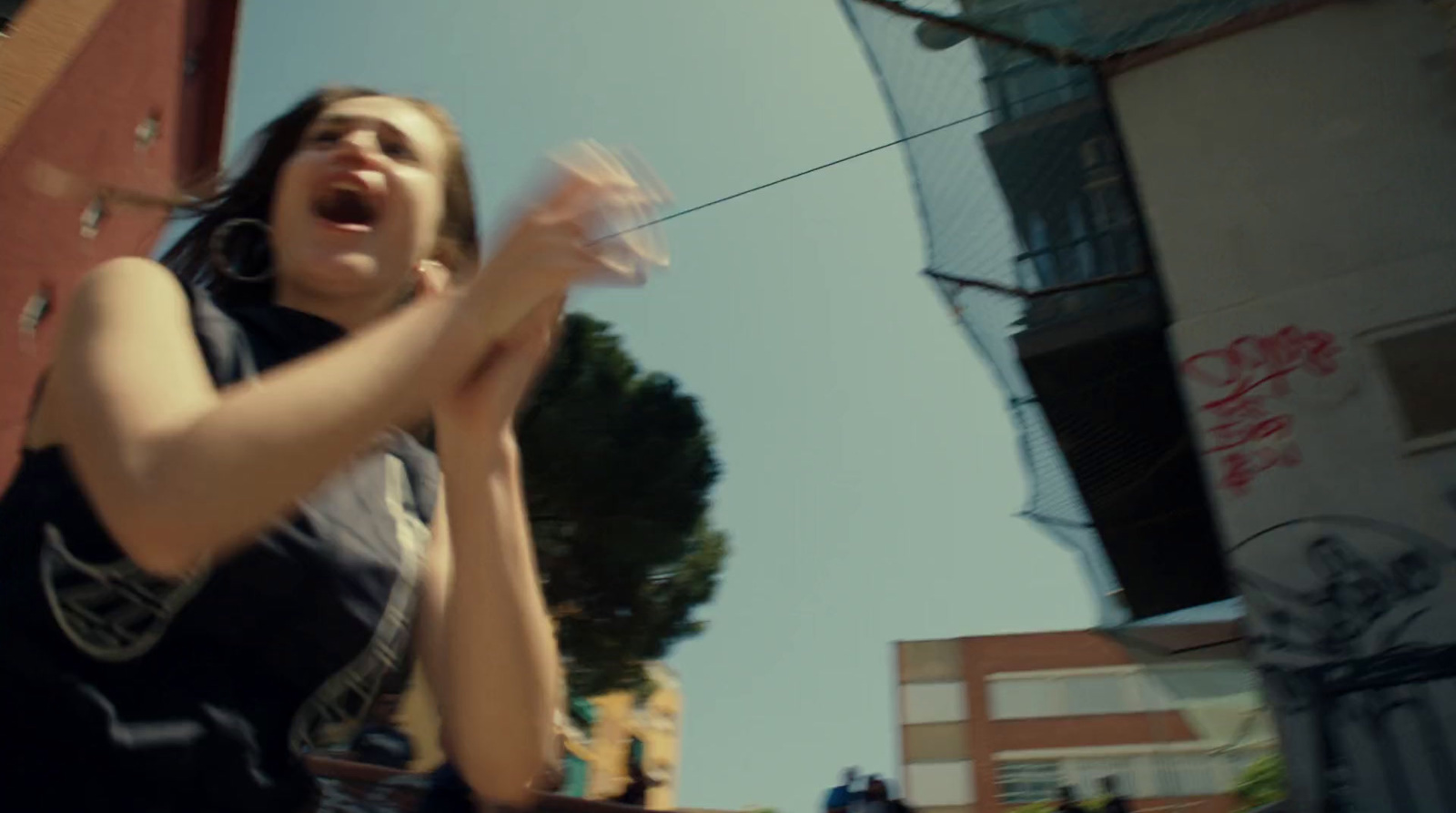 a woman holding a frisbee in her right hand