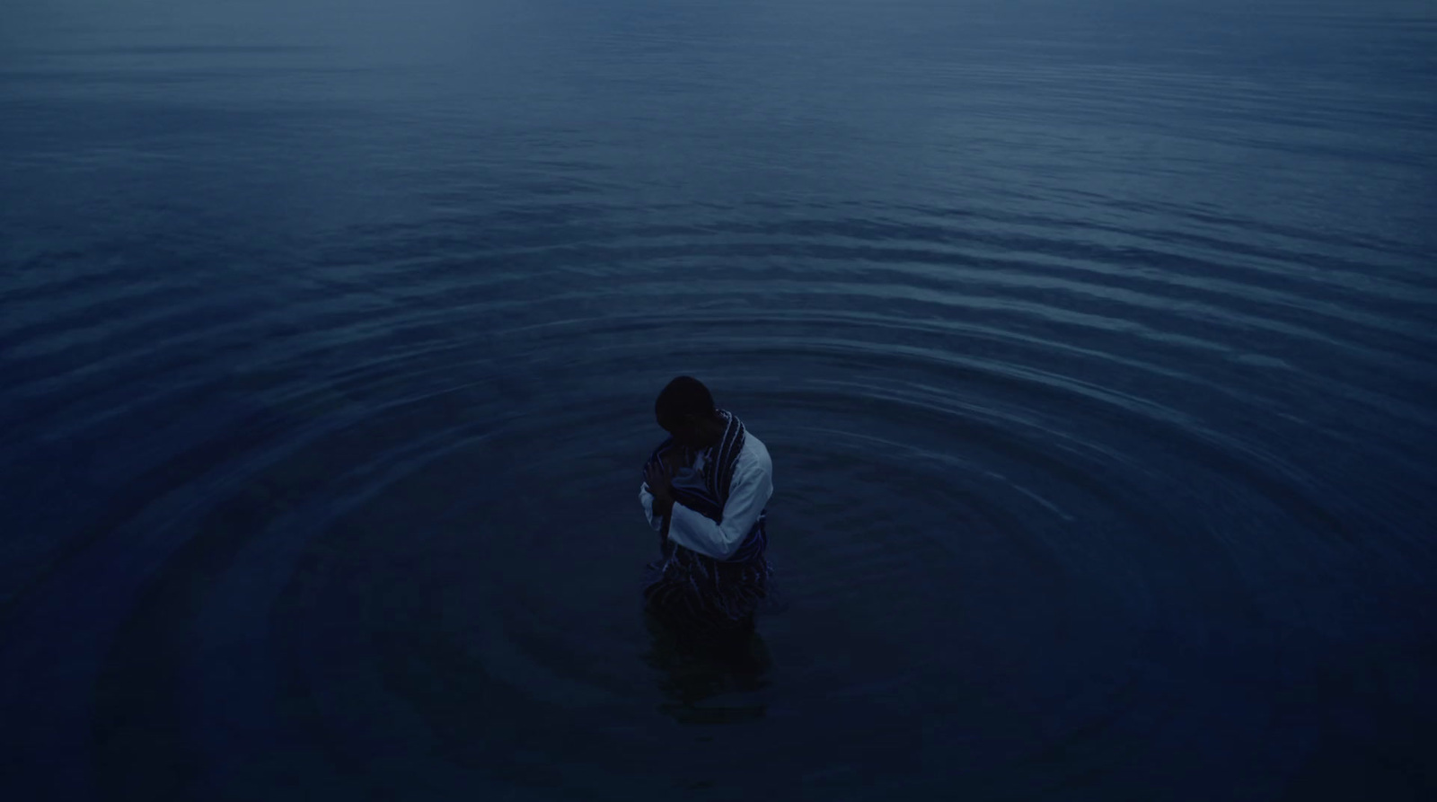 a person standing in a body of water