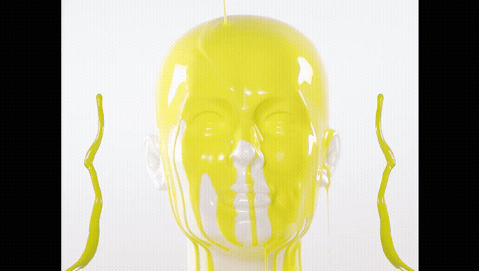 a yellow and white sculpture of a man's head