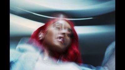 a woman with red hair is making a face